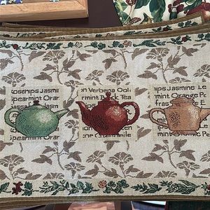 8 Floral with Teapots Fabric Placemats made by At Home. All in good condition.